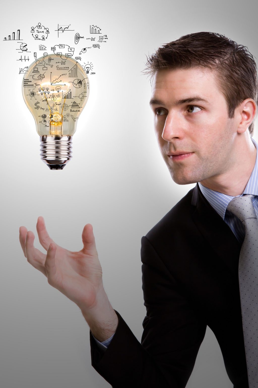 Business Man Holding Light Bulb With Business Concept Inside